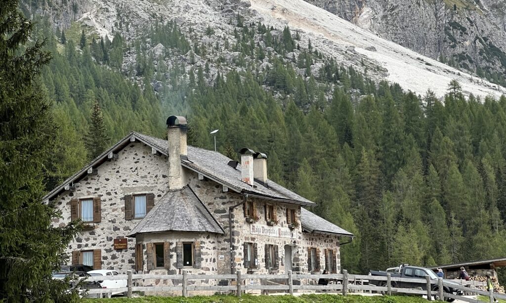 Mountain hut in Trentino with mountains in the background – guide to getting a Codice Fiscale in Trentino, Italy