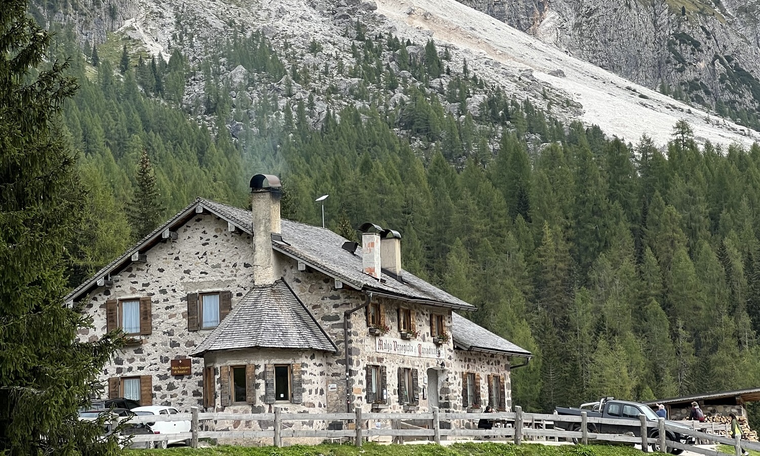 Mountain hut in Trentino with mountains in the background – guide to getting a Codice Fiscale in Trentino, Italy